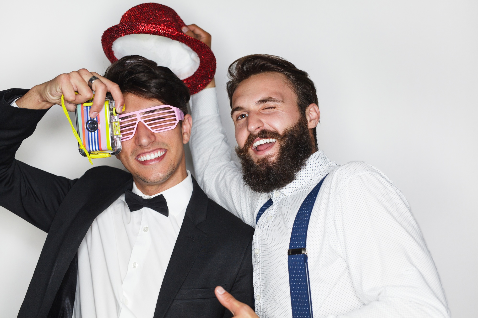Man partying up and posing happily